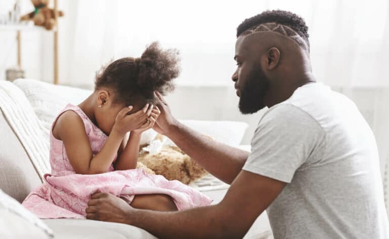 girl crying with dad