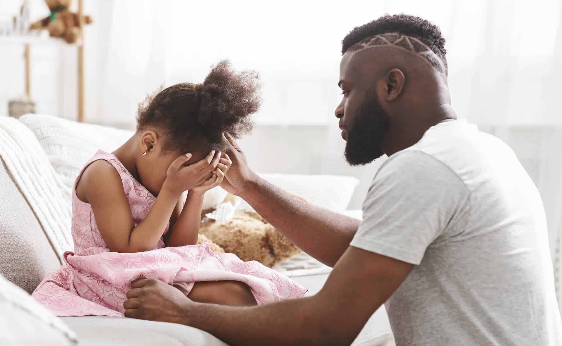 girl crying with dad